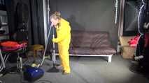 Watching sexy SANDRA vacuum cleaning the studio wearing a sexy yellow rainwear combination (Video)