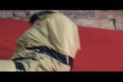 Jill tied, gagged and hooded lying on the floor wearing sexy shiny nylon golden rainwear (Video)