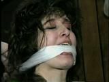 ERICA IS RING GAGGED, MOUTH STUFFED, CLEAVE GAGGED & TIED WITH BLACK NYLON ROPE (D36-10)