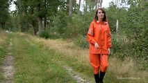 Miss Petra takes a walk in a orange AGU rain suit and rubber boots