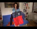 Jill folding shiny nylon clothes wearing shiny nylon clothes (Video) 