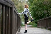 Miss Petra in a hot vinyl skirt, high heels and transparent blouse at photo shooting
