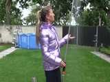 Watch Sandra taking a shower in her new purple shiny nylon down jacket 