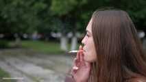 Pretty Ksenia is smoking 120mm cork cigarettes