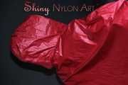 Watching sexy Sandra putting on several layers of shiny nylon rainwear ending with a red raincape (Pics) 