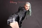 Mara wearing a sexy black shiny nylon shorts and a black rain jacket posing for you (Pics)