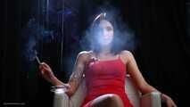 Sexy lady in red is smoking two 100mm reds