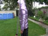 Watch Sandra taking a shower in her new purple shiny nylon down jacket 