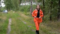 Miss Petra takes a walk in a orange AGU rain suit and rubber boots