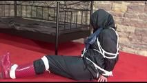 Jill tied, gagged and hooded lying on the floor wearing sexy shiny nylon black rainwear (Video)