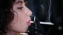 Great smoker Anastasia is smoking two all white cigarettes in a leather  gloves