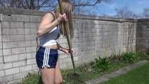 Sexy Sandra wearing a sexy darkblue shiny nylon shorts and a blue downvest during her gardening work (Video)