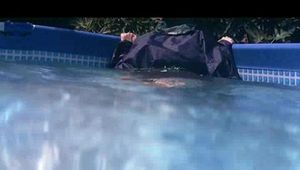 Mara wearing sexy shiny nylon rainwear while taking a bath in the swimming pool (Video)