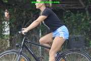 Watch Sandra riding her bike enjoying her shiny nylon shorts