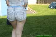 Watch Chloe taking a Sunbath wearing her shiny nylon Shorts under her jeans Shorts 