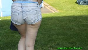 Watch Chloe taking a Sunbath wearing her shiny nylon Shorts under her jeans Shorts 