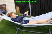 Watching sexy RONJA wearing a sexy oldscholl blue shiny nylon shorts and a rainjacket lolling in a hammock enjoying the sun (Video)