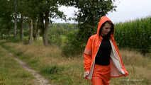 Miss Petra takes a walk in a orange AGU rain suit and rubber boots