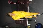 Watching sexy Sandra wearing a hot yellow shiny nylon rainwear combination during her housework (Pics)