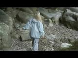 Sophie enjoying the water and weather on a river wearing supersexy grey rainwear (Video)