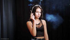 18 years old Tanya is smoking 120mm cigarette