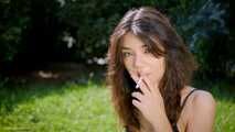Arina is smoking 120mm cigarettes outdoors