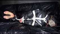 Sexy Sandra being tied and gagged with ropes on a sofa wearing a sexy black down pants and a black shiny nylon down jacket (Video)