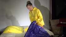 Watching sexy Sandra wearing different shiny nylon rainwear and preparing bed  (Video)