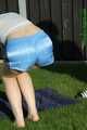 Watch Chloe taking a Sunbath wearing her shiny nylon Shorts under her jeans Shorts 