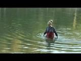 Jenny bathing in a lake and sun bathing wearing sexy red shiny nylon shorts and a rain jacket (Video)