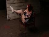 Mia in Attic Chair and white dirty sneakers