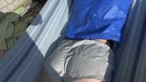 SEXY Sonja wearing sexy shiny nylon shorts enjoying the sun and the shorts in a hammock (Video)