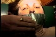 46 Yr OLD REAL ESTATE AGENT'S IS MOUTH STUFFED, HANDGAGGED, DUCT TAPE GAGGED, TOP-LESS, TIT TIED, FONDLED, TOE-TIED, UPSKIRT AND TIGHTLY TIED ON A MASSAGE TABLE  (D69-11)