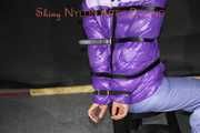 Watching sexy Sandra wearing a sexy blue rain pants and a purple down jacket being tied, gagged and hooded on a chair (Pics)