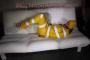 Watching Pia being tied and gagged with tape and a cloth gag wearing sexy yellow shiny nylon rainwear (Pics)