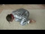 Video with Alina tied and gagged in a shiny pvc sauna suit