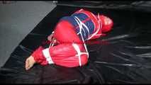 SANDRA tied, gagged and hooded on the floor wearing a supersexy oldschool red/blue down suit (Video)