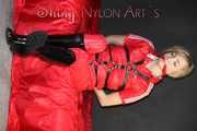 ***HOT***HOT***HOT***Mia wearing a sexy red shiny nylon jumpsuit and black shiny heel rubber boots being tied and gagged with belts and a clothgag (Pics)