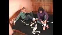 Catt and Alexa - Naughty girl tied up before joining helpless girlfriend on the bed (video)