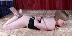 Florence chained hogtied on bed