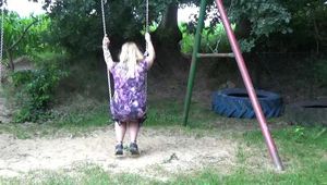 Miri cuffed on a swing