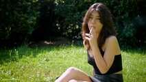 Arina is smoking 120mm cigarettes outdoors