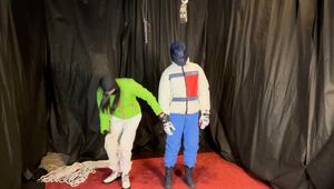 Sebastien breathplay in 2 down jackets is hanging tied the in a hogtie.