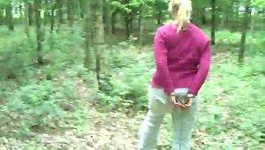 Walking chained and cuffed in the wood