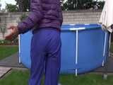 Watch Sandra enjoying Shower in her shiny nylon Downwear in the Garden