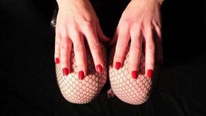 Fishnet tights and red fingernails