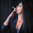 Alluring wonder woman Tanya enjoying a white 120mm cigarette