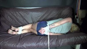 Sexy Pia being tied and gagged with ropes and a cloth gag on a sofa wearing a sexy black shiny nylon shorts and a grey tshirt (Video)