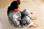 Alina tied and gagged in a shiny silver PVC saunasuit