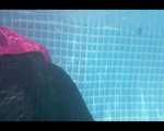 Mara swimming in the pool wearing a sexy rainwear combination (Video)